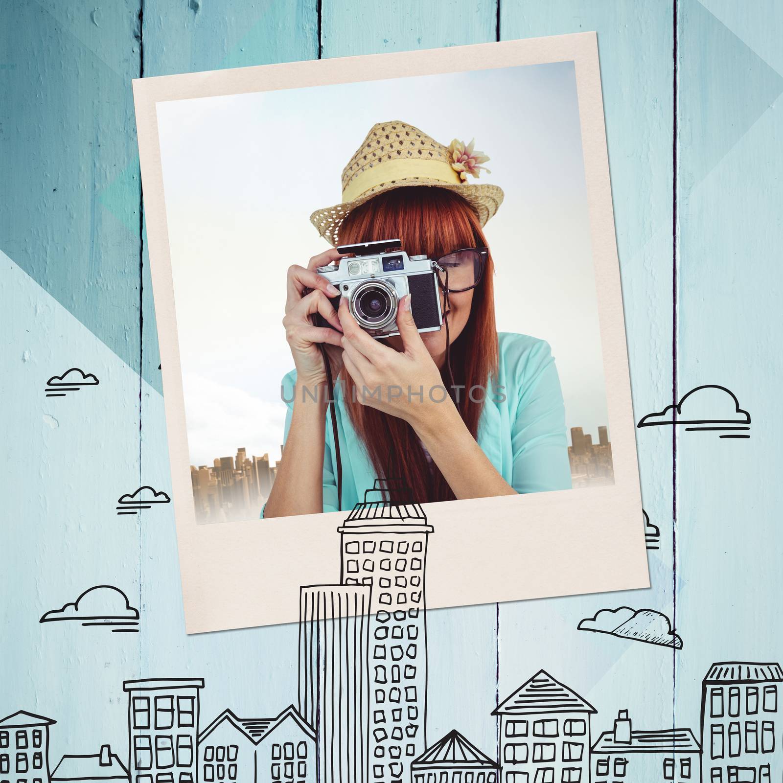 Portrait of a smiling hipster woman holding retro camera against colored wood