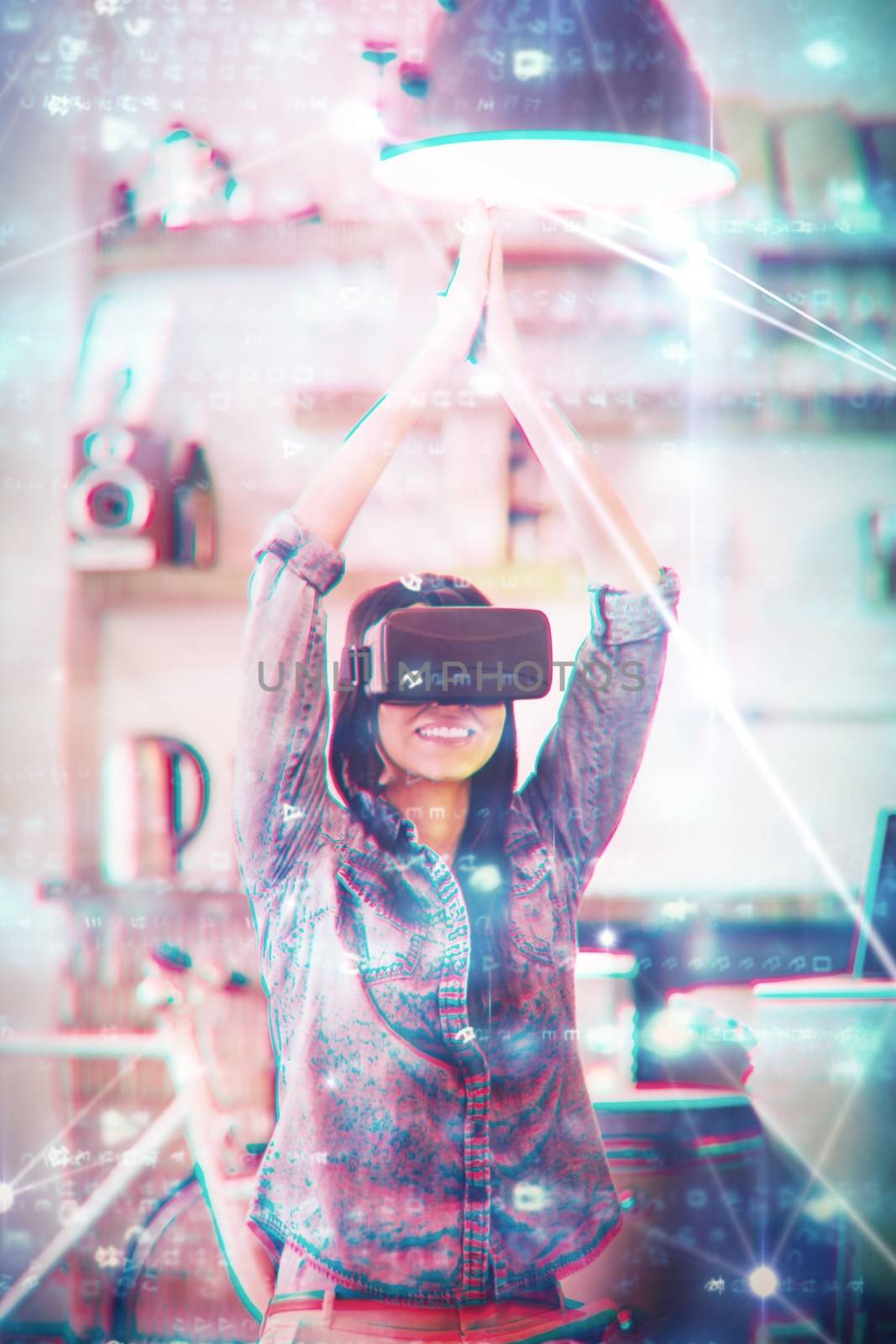 Glowing blue background against young woman using the virtual reality headset