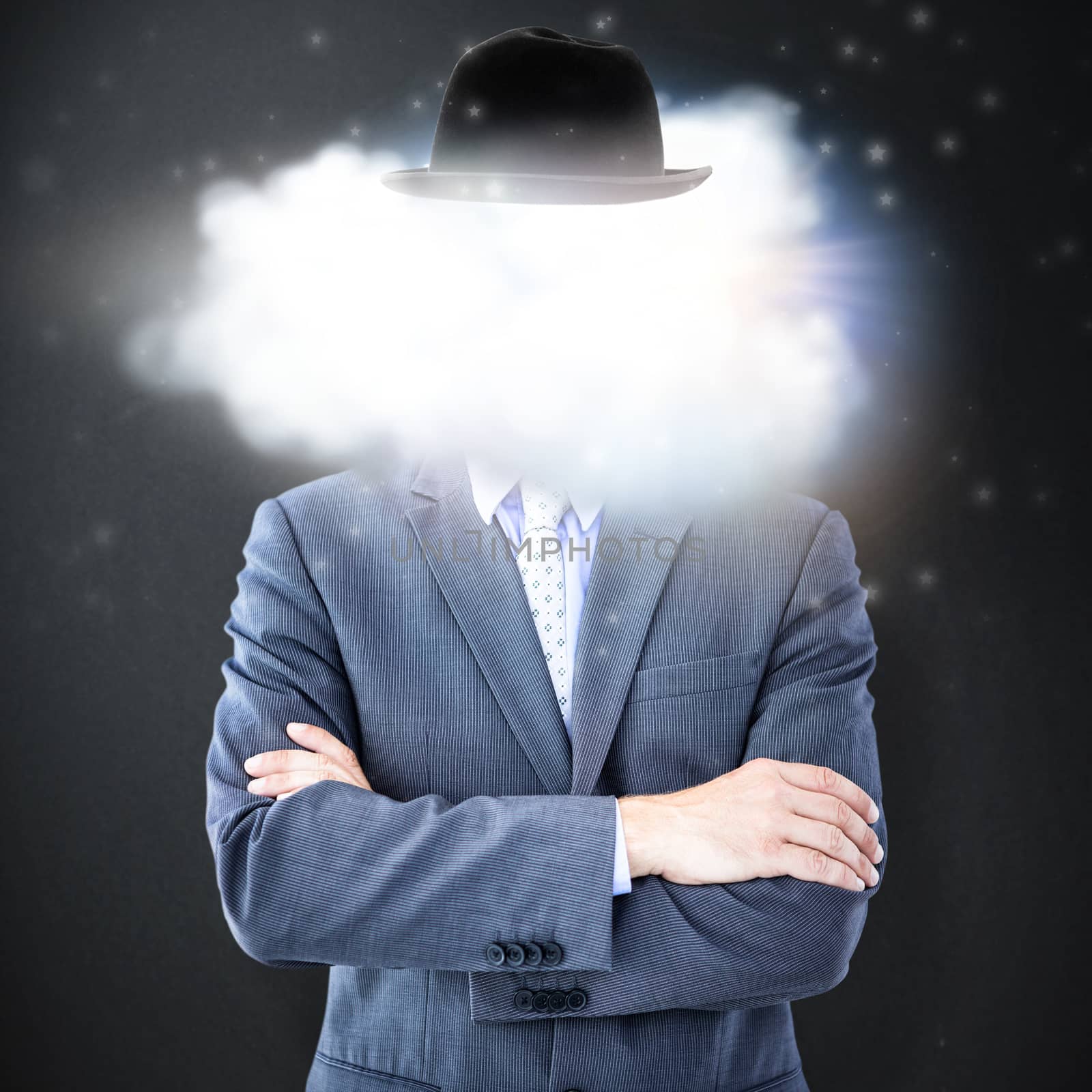 Midsection of businessman standing arms crossed against grey background