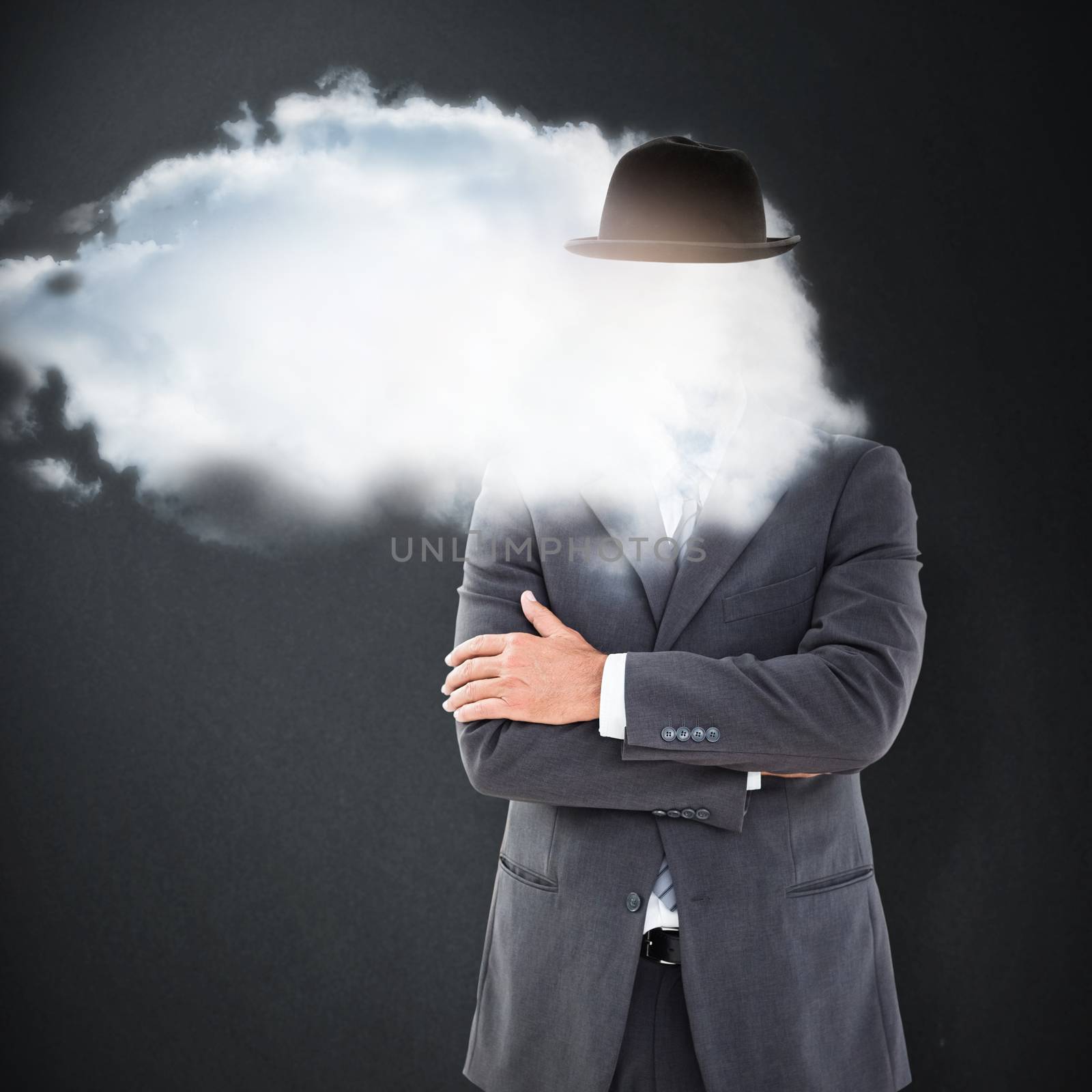 Serious businessman against grey background
