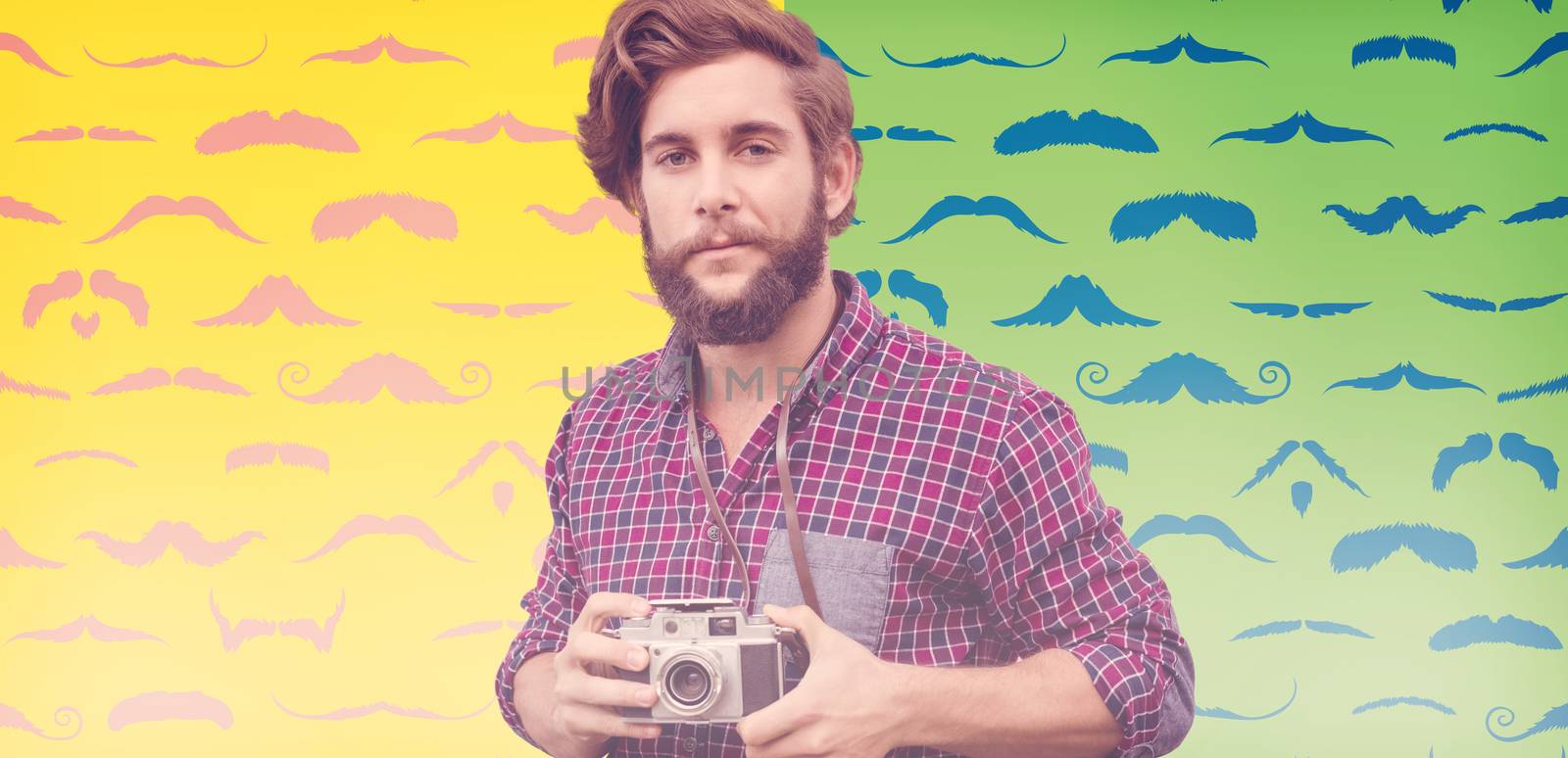 Portrait of confident hipster using camera against composite image of mustaches