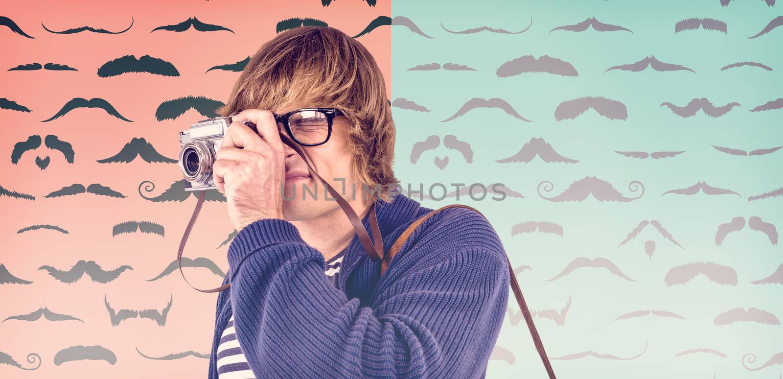 Hipster taking pictures with an old camera  against composite image of mustaches