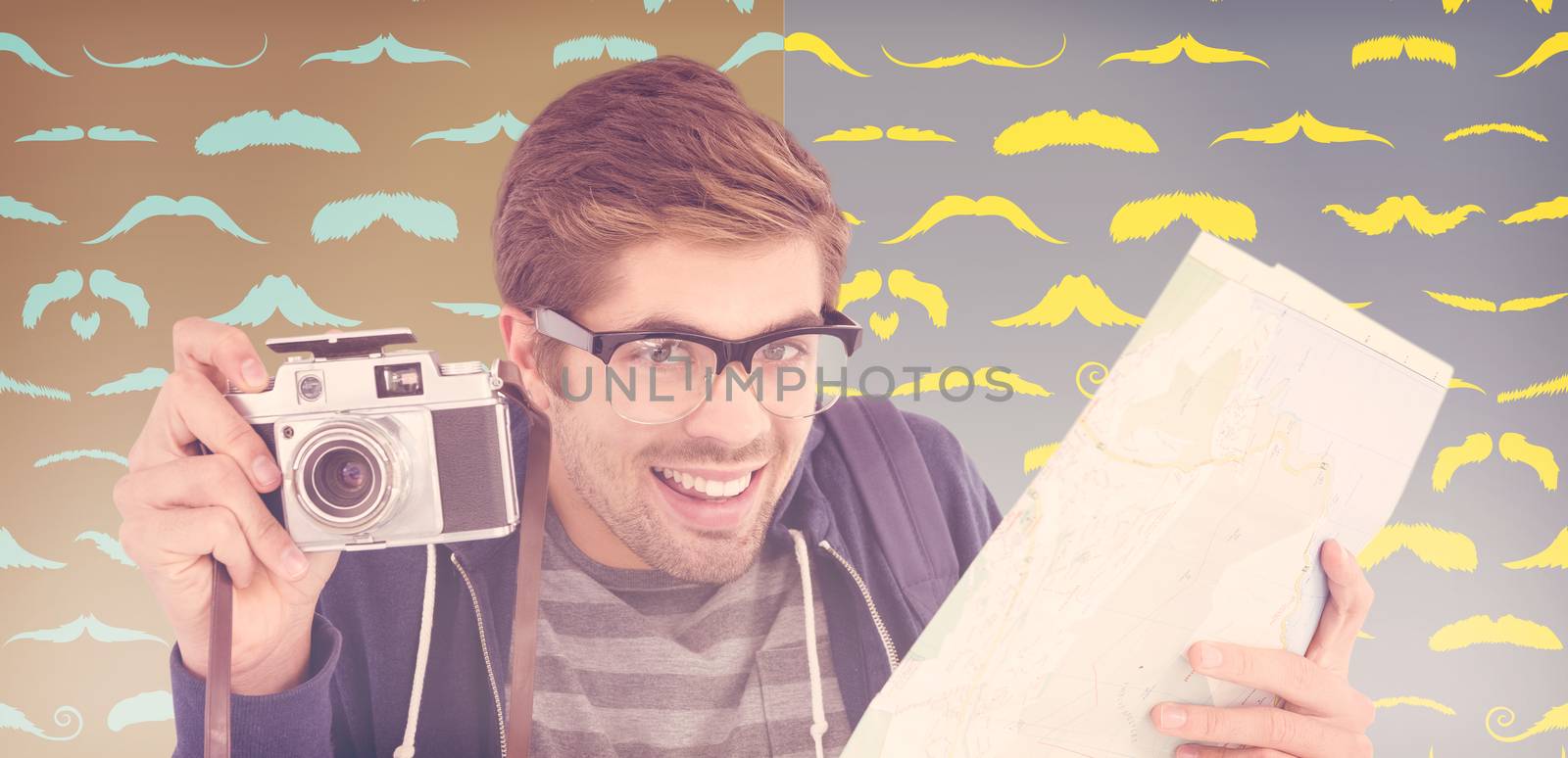 Portrait of happy man holding map and camera against composite image of mustaches