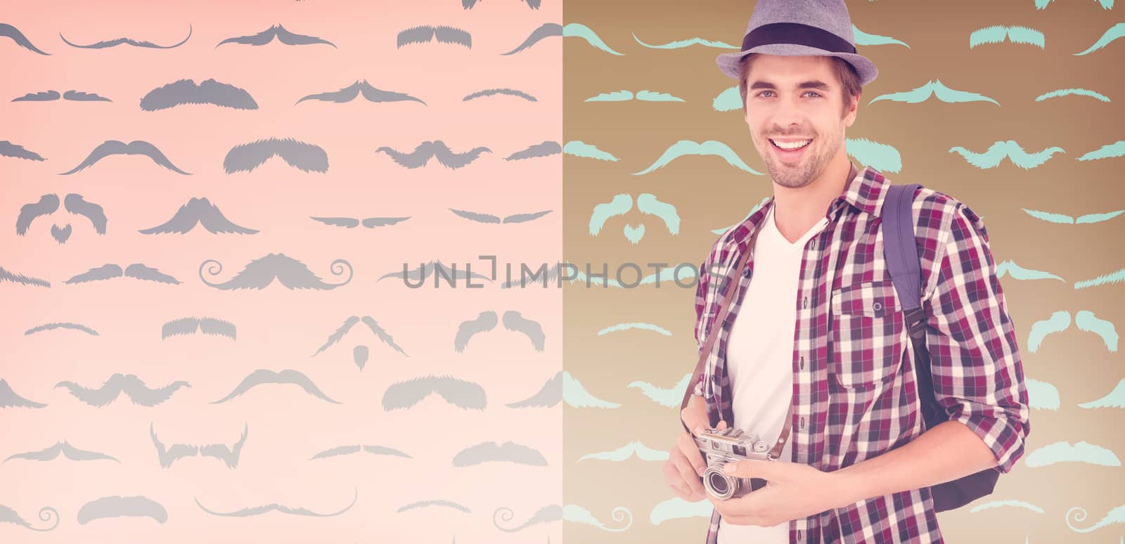 Portrait of man smiling while holding camera against composite image of mustaches