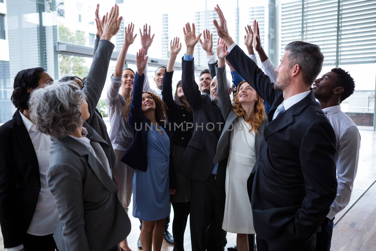 Business people raising their arms by Wavebreakmedia