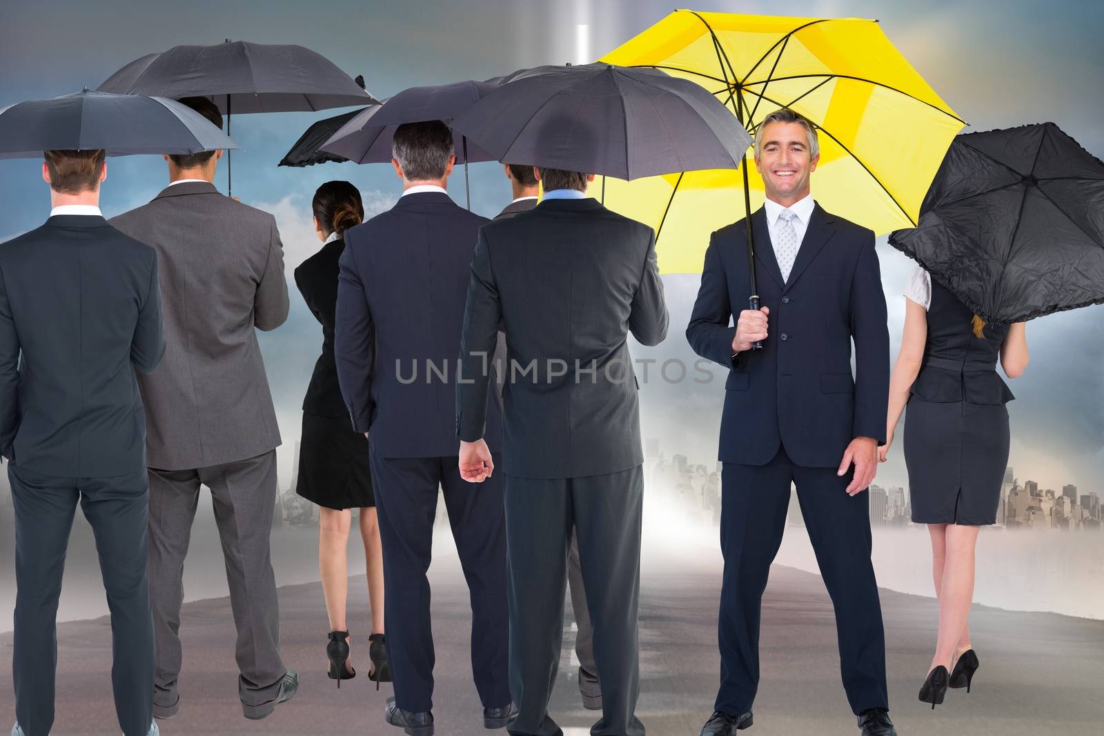 Business people holding umbrellas by Wavebreakmedia