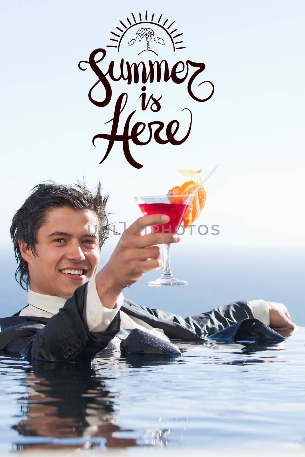 Businessman sitting in the water with a cocktail by Wavebreakmedia