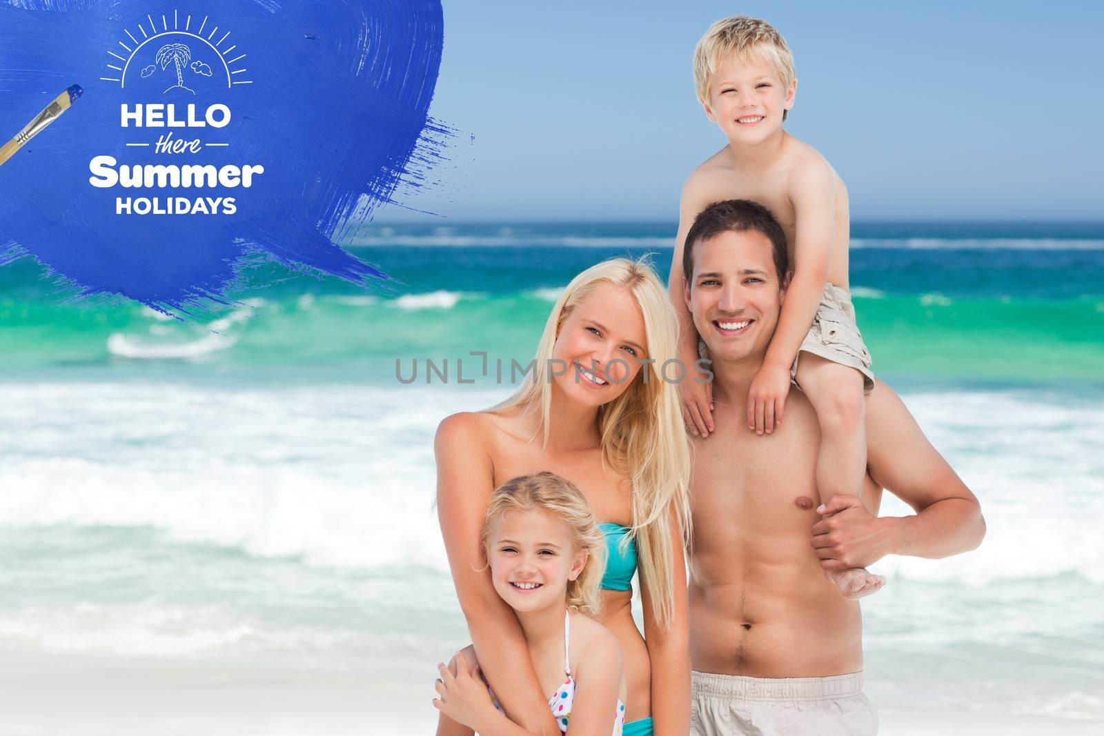 Family standing in the sea on a summer day