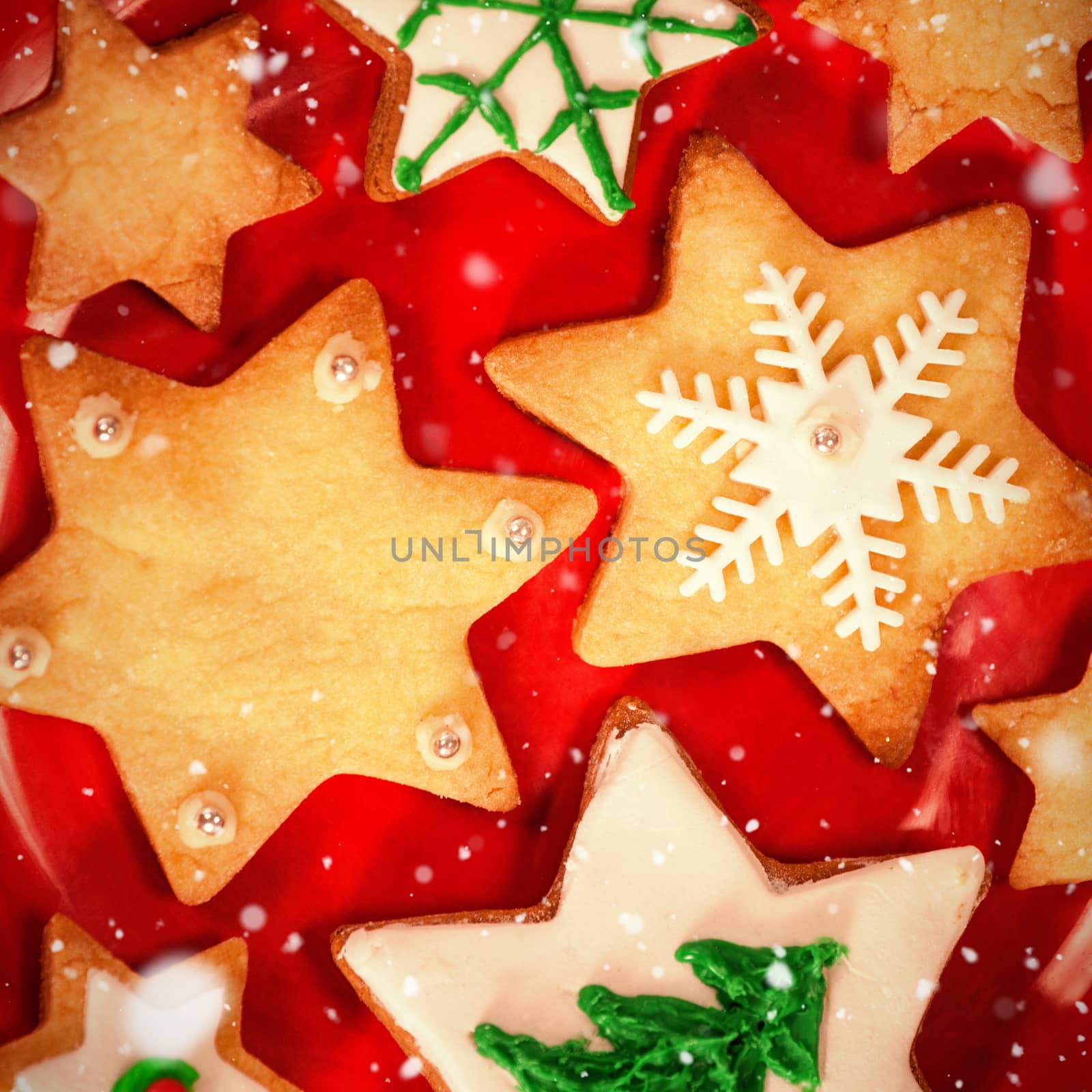 Snow falling against various cookies arranged on plate