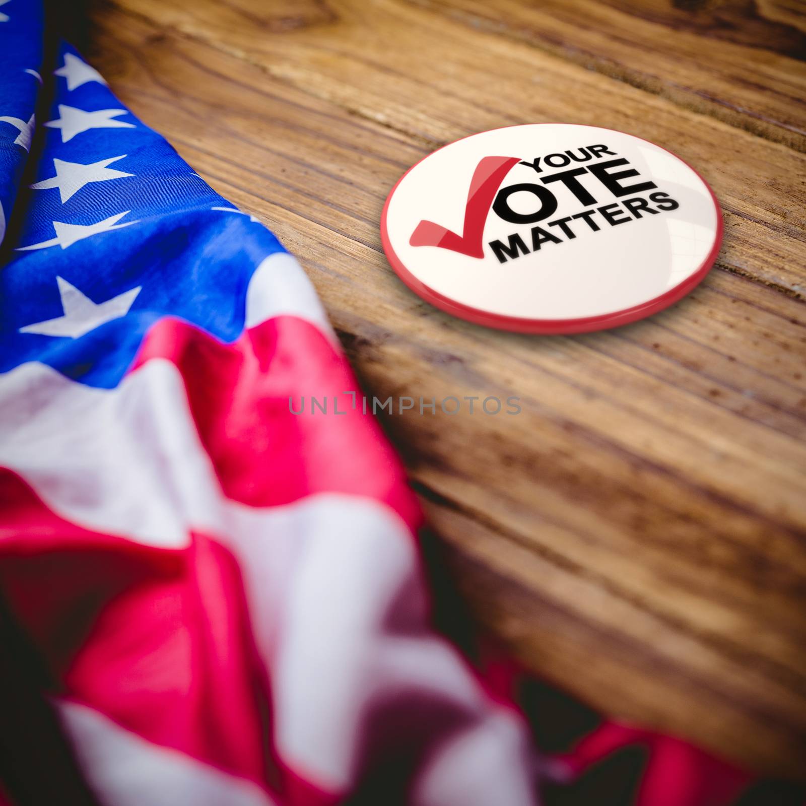 Political button against usa flag on table