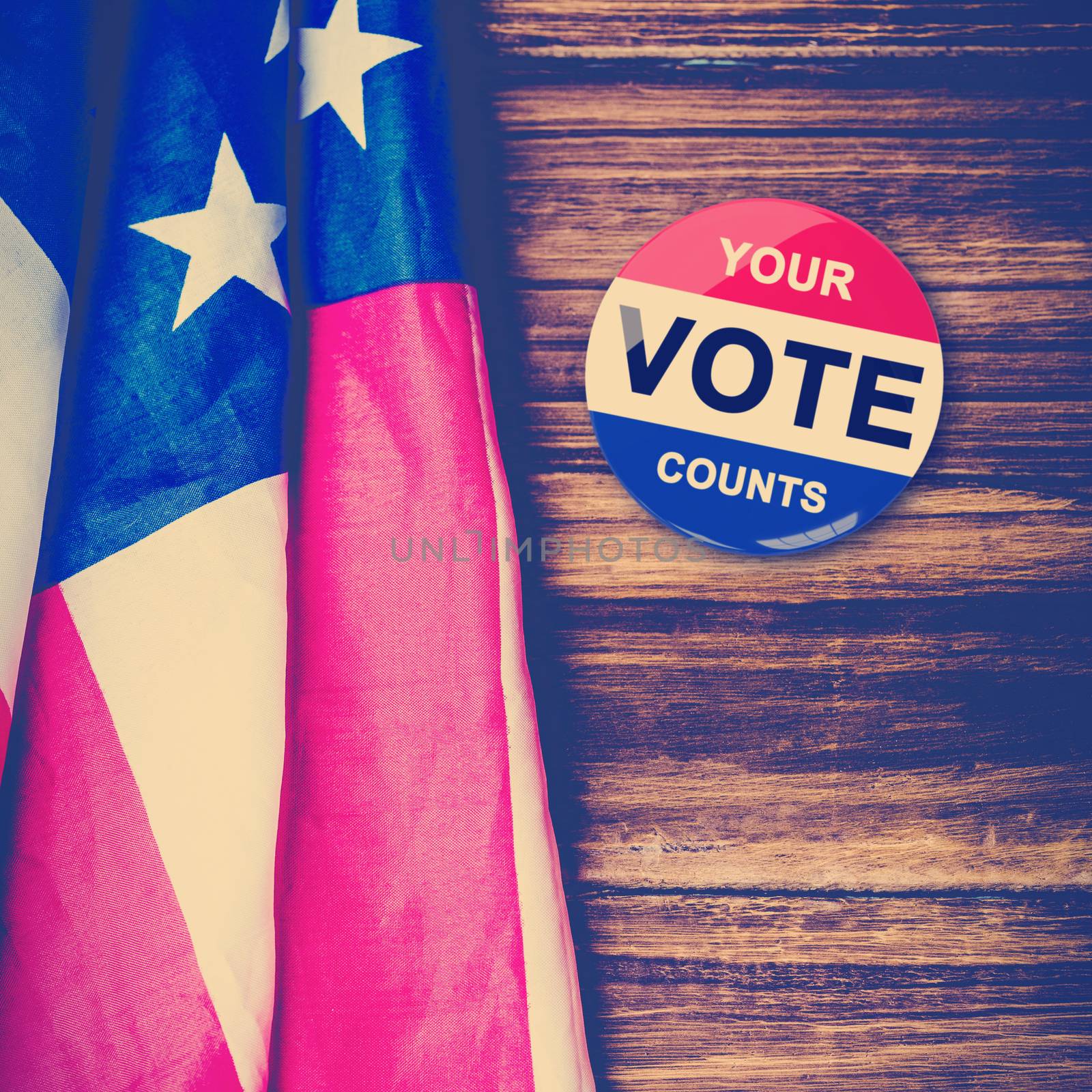 Political button against usa flag on table