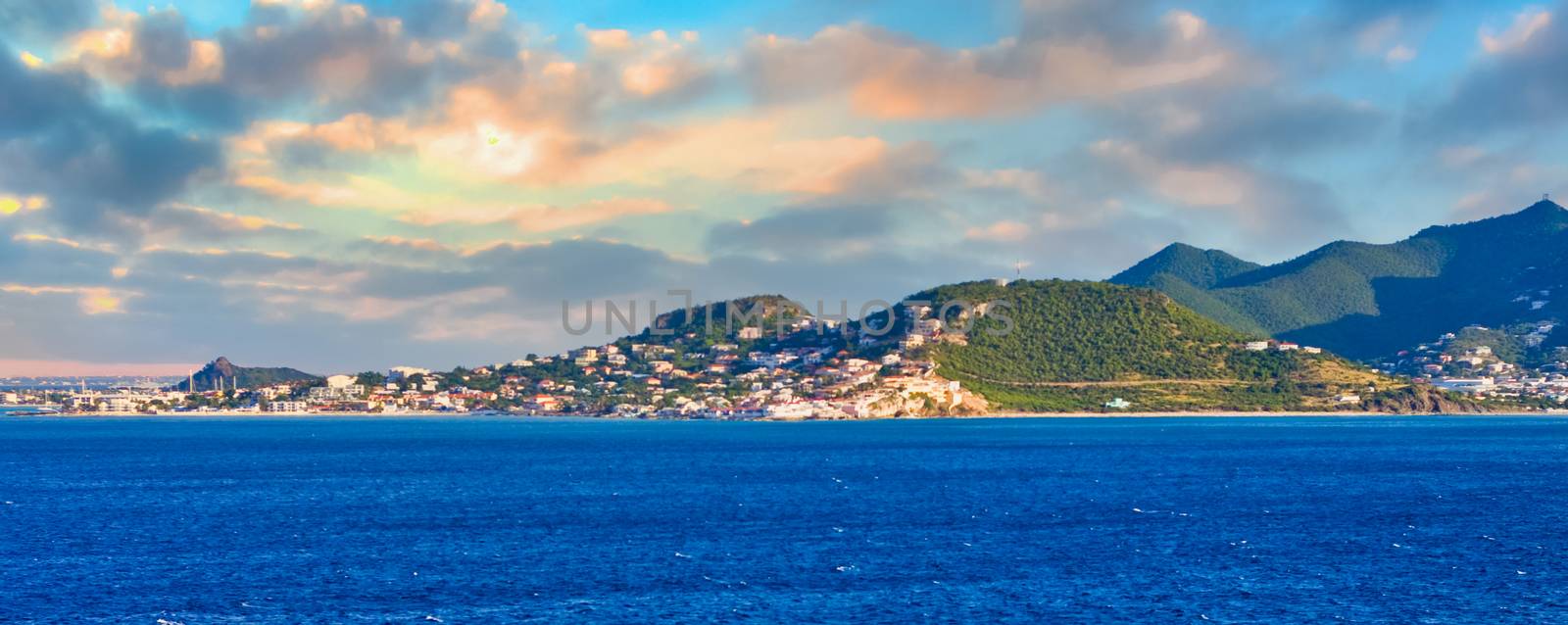 The coast off a tropical island with deep blue sea