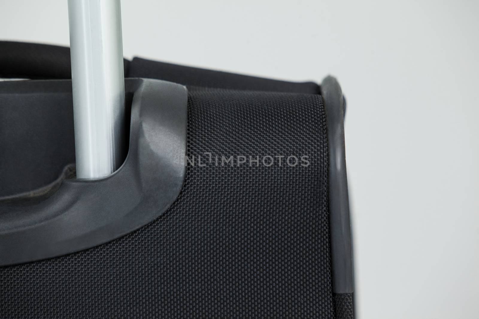 Close-up of travel bag on white background
