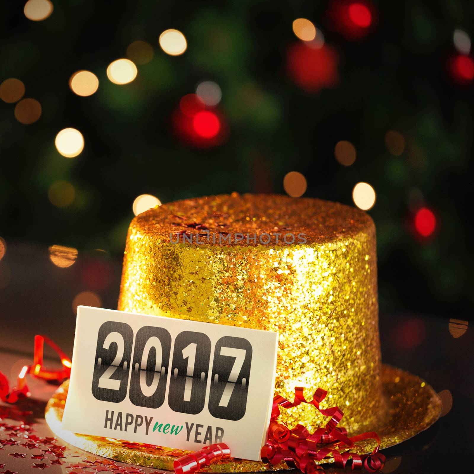  Digital composite of Happy new year card leaning on gold party hat