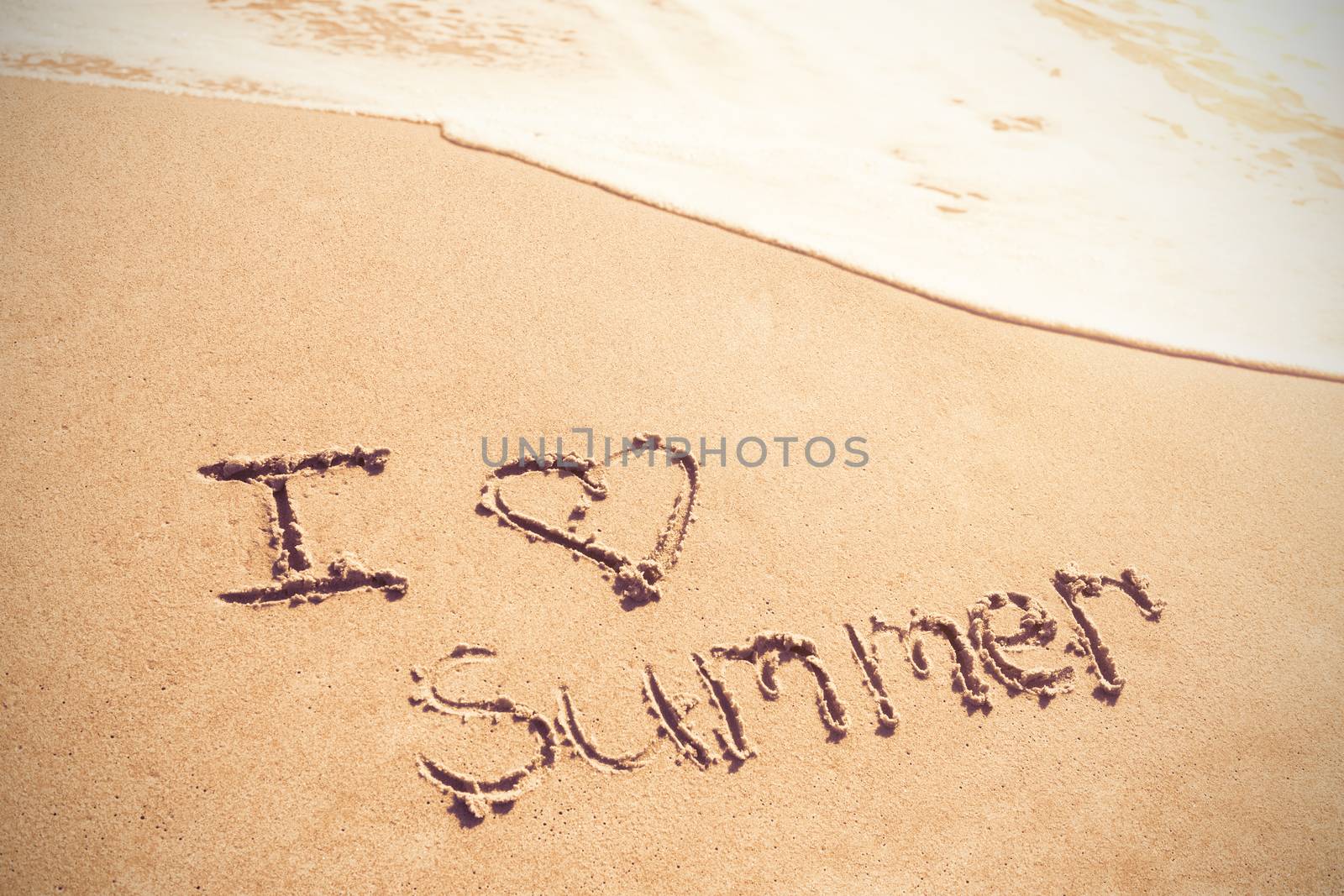I love summer written on sand by Wavebreakmedia