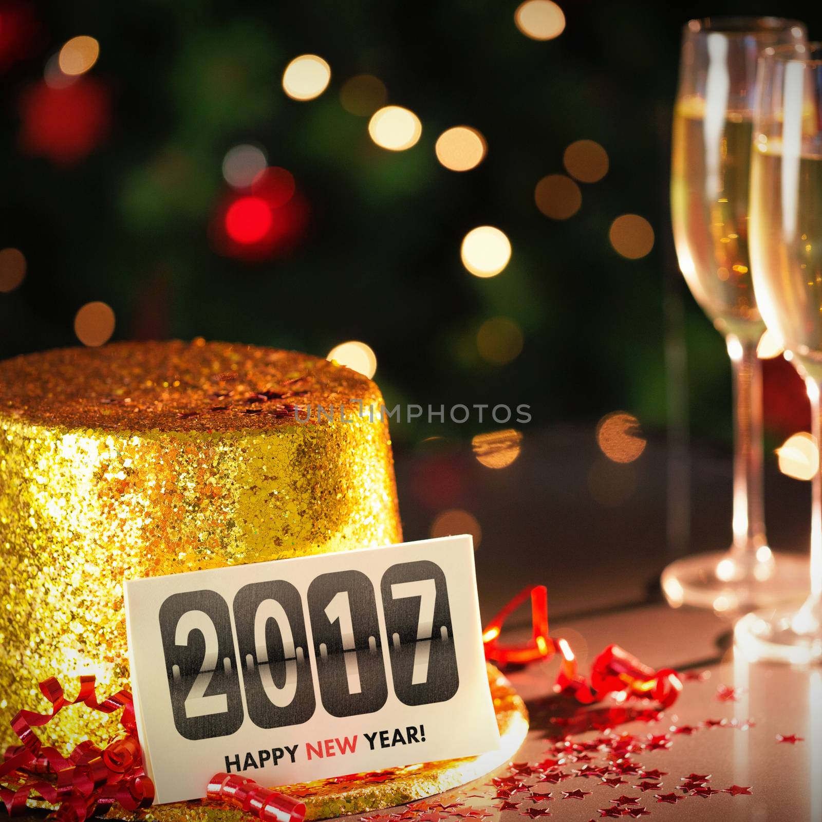  Digital composite of Happy new year card leaning on gold party hat