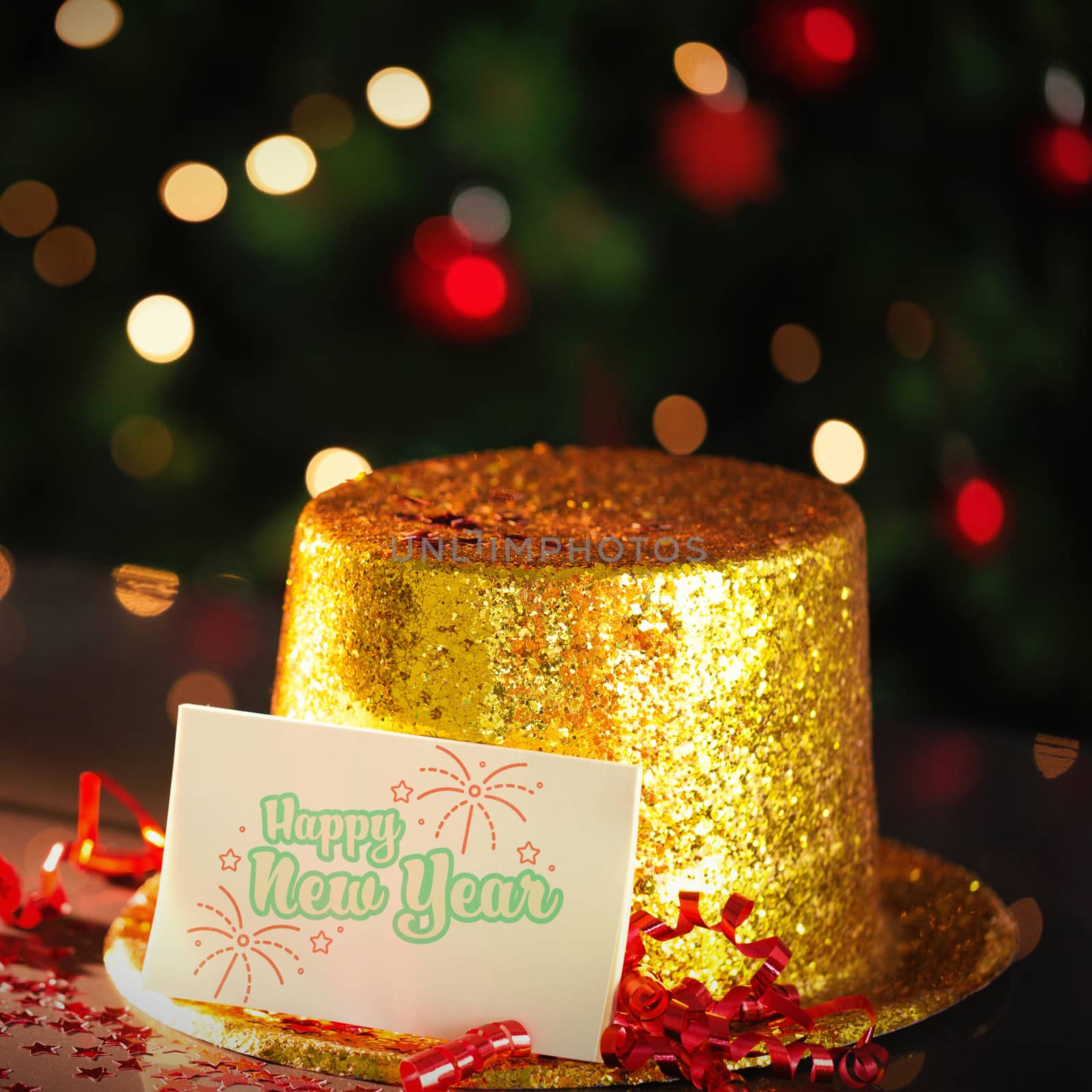  Digital composite of Happy new year card leaning on gold party hat