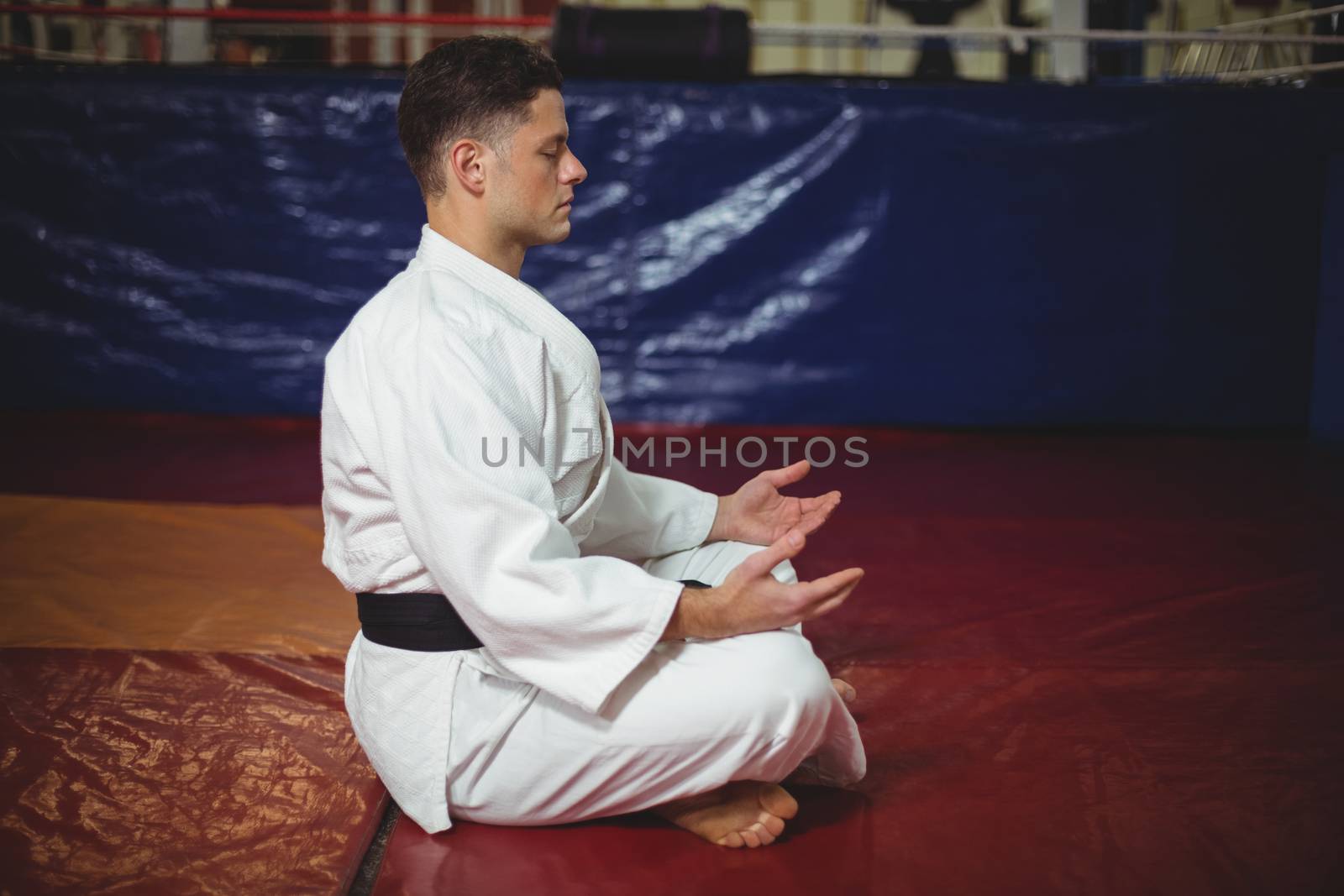 Karate player doing yoga by Wavebreakmedia