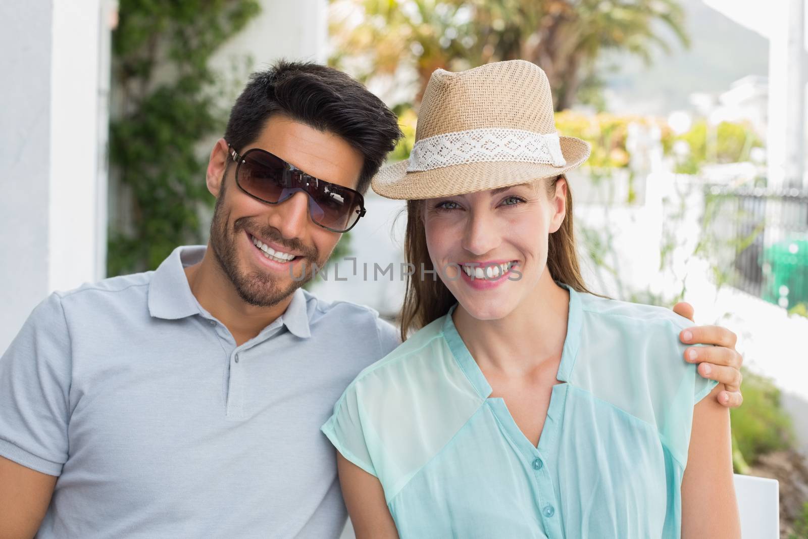 Close-up portrait of a loving couple smiling outdoors