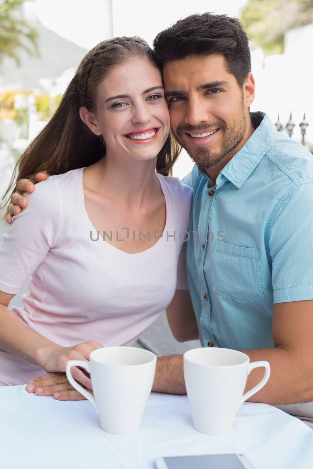 Portrait of a romantic couple at coffee shop by Wavebreakmedia