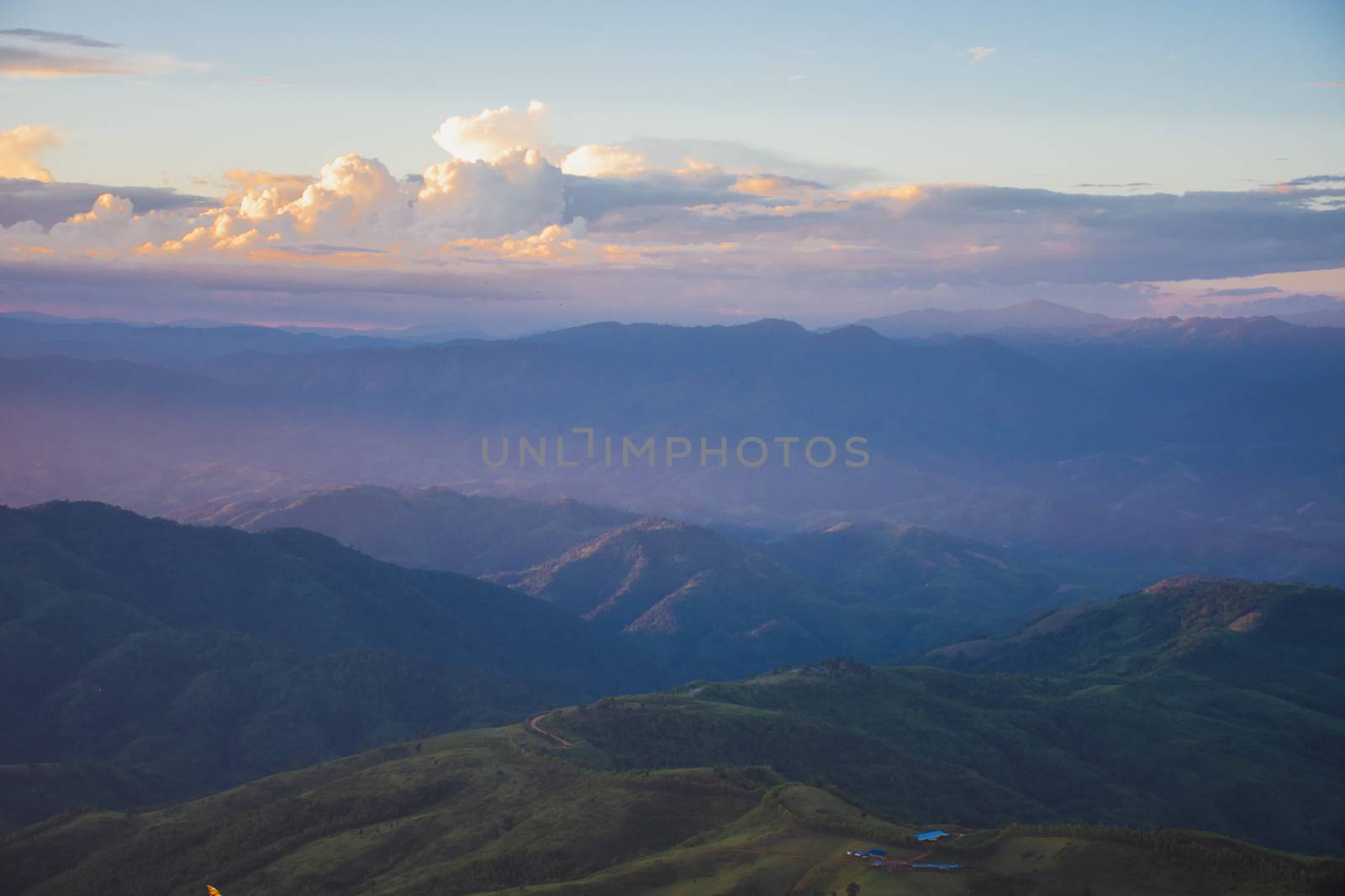 Sunset, mountains and beautiful clouds at Doi Chang, Mae Fah Lua by anuraksir