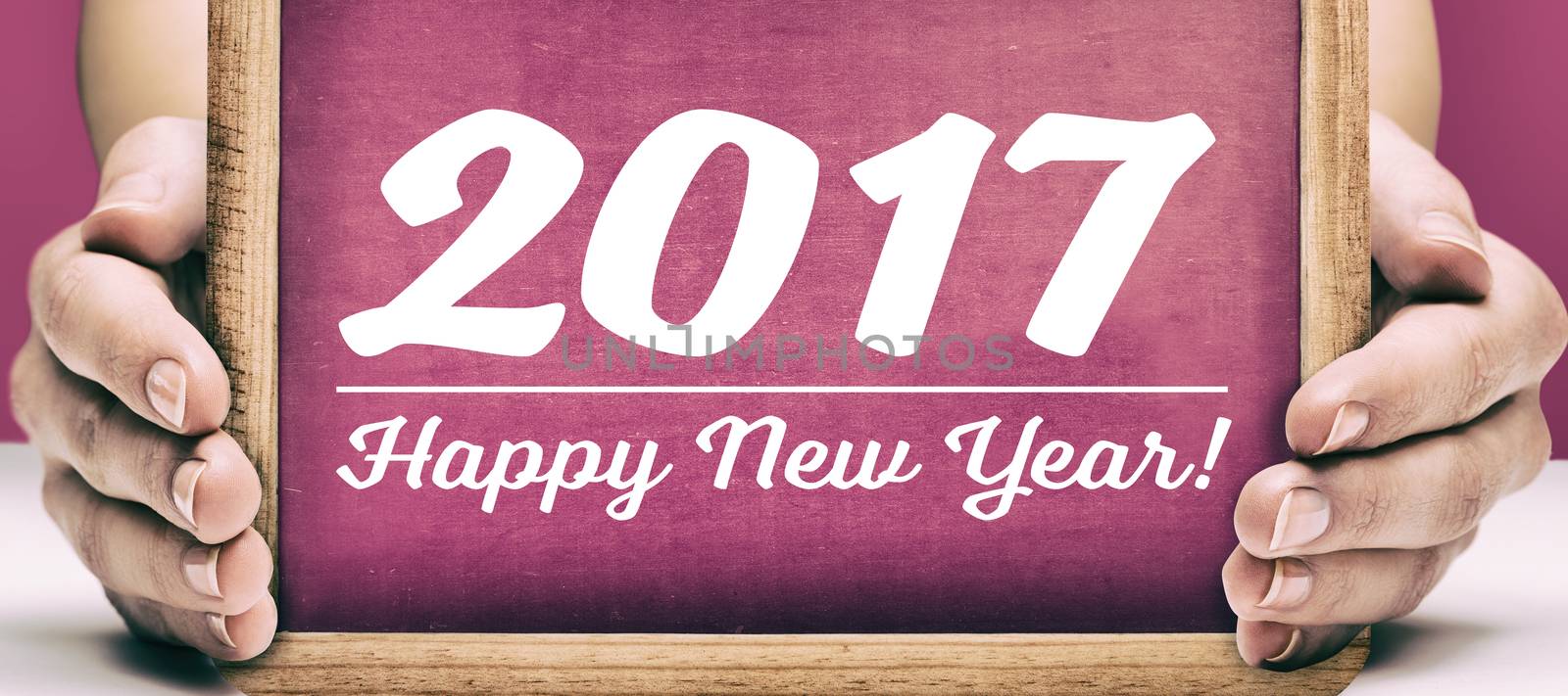 Slate with happy new year text by Wavebreakmedia