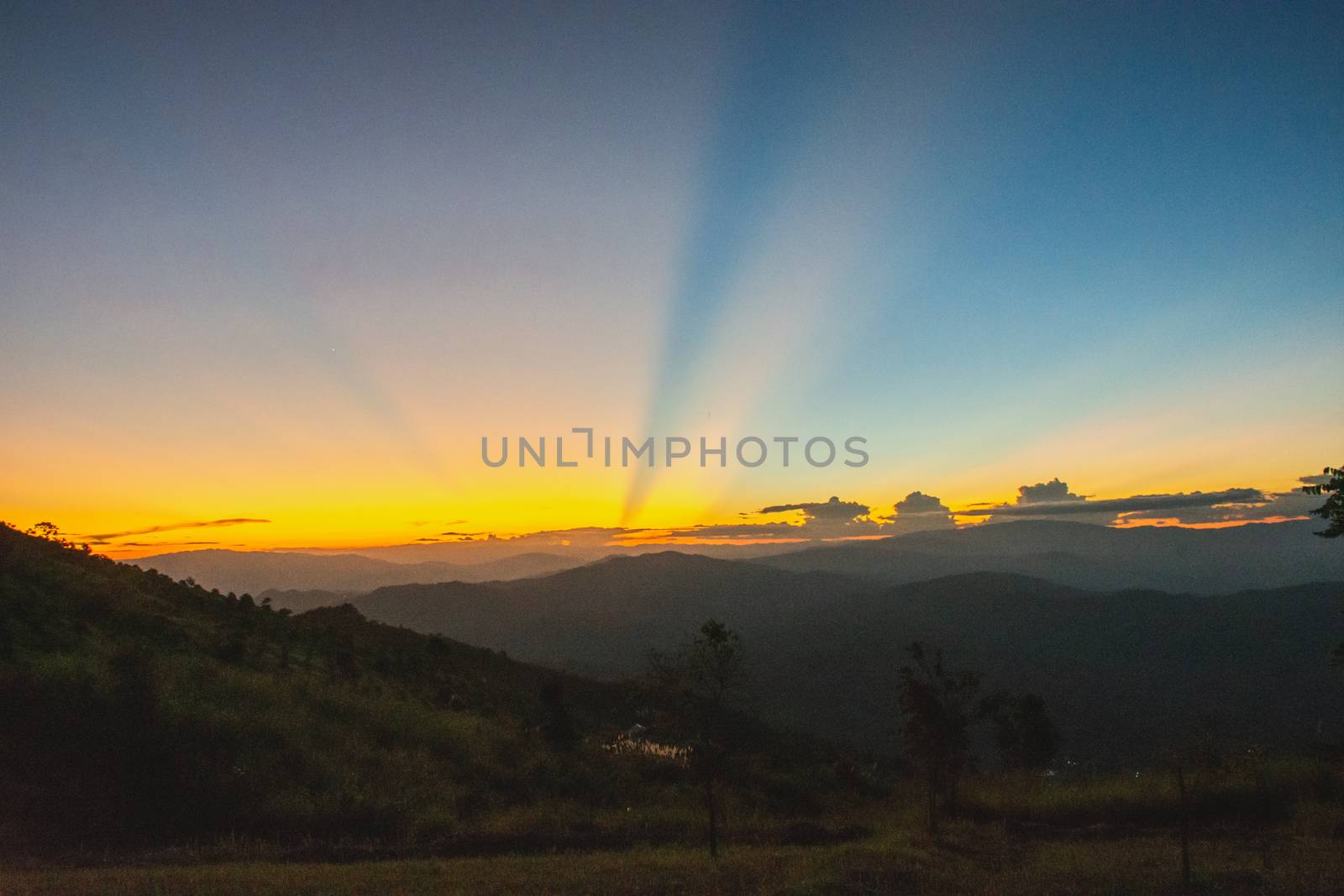 Sunset, mountains and beautiful clouds at Doi Chang, Mae Fah Luang Village, Chiang Rai, Thailand