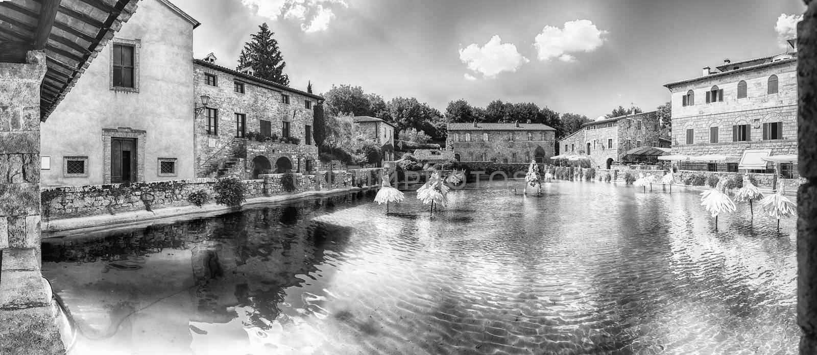 Panoramic view of the iconic medieval thermal baths, major landmark and sightseeing in the town of Bagno Vignoni, province of Siena, Tuscany, Italy