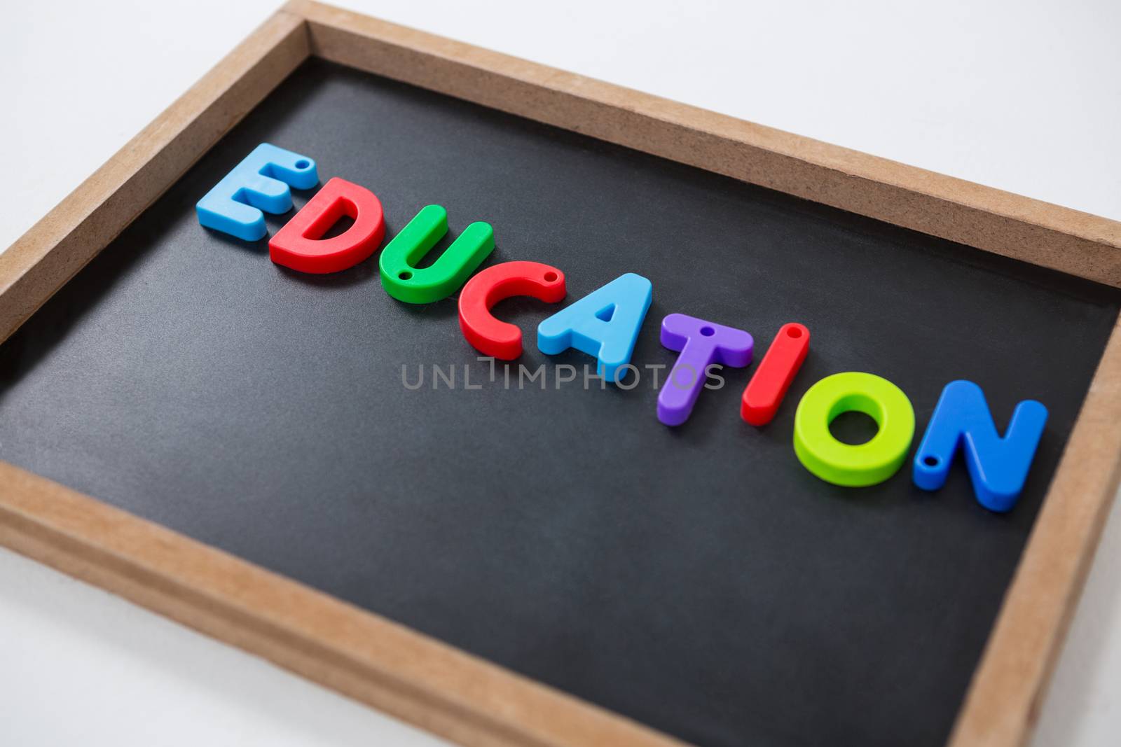 Close-up of letter education block on slate