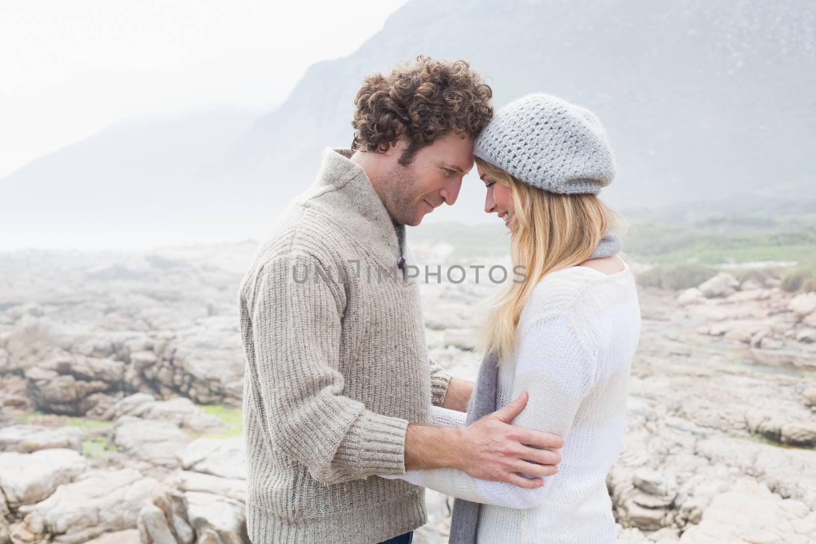 Romantic couple standing on a rocky landscape by Wavebreakmedia