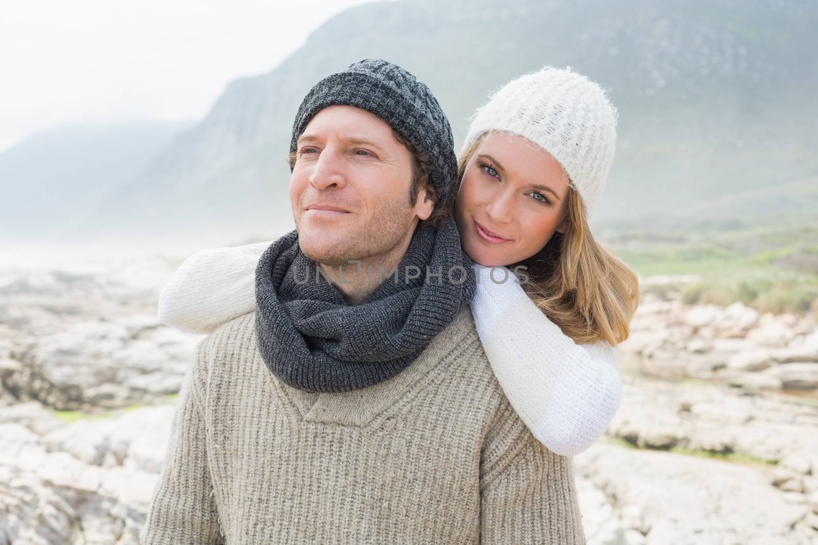 Romantic young couple together on a rocky landscape by Wavebreakmedia