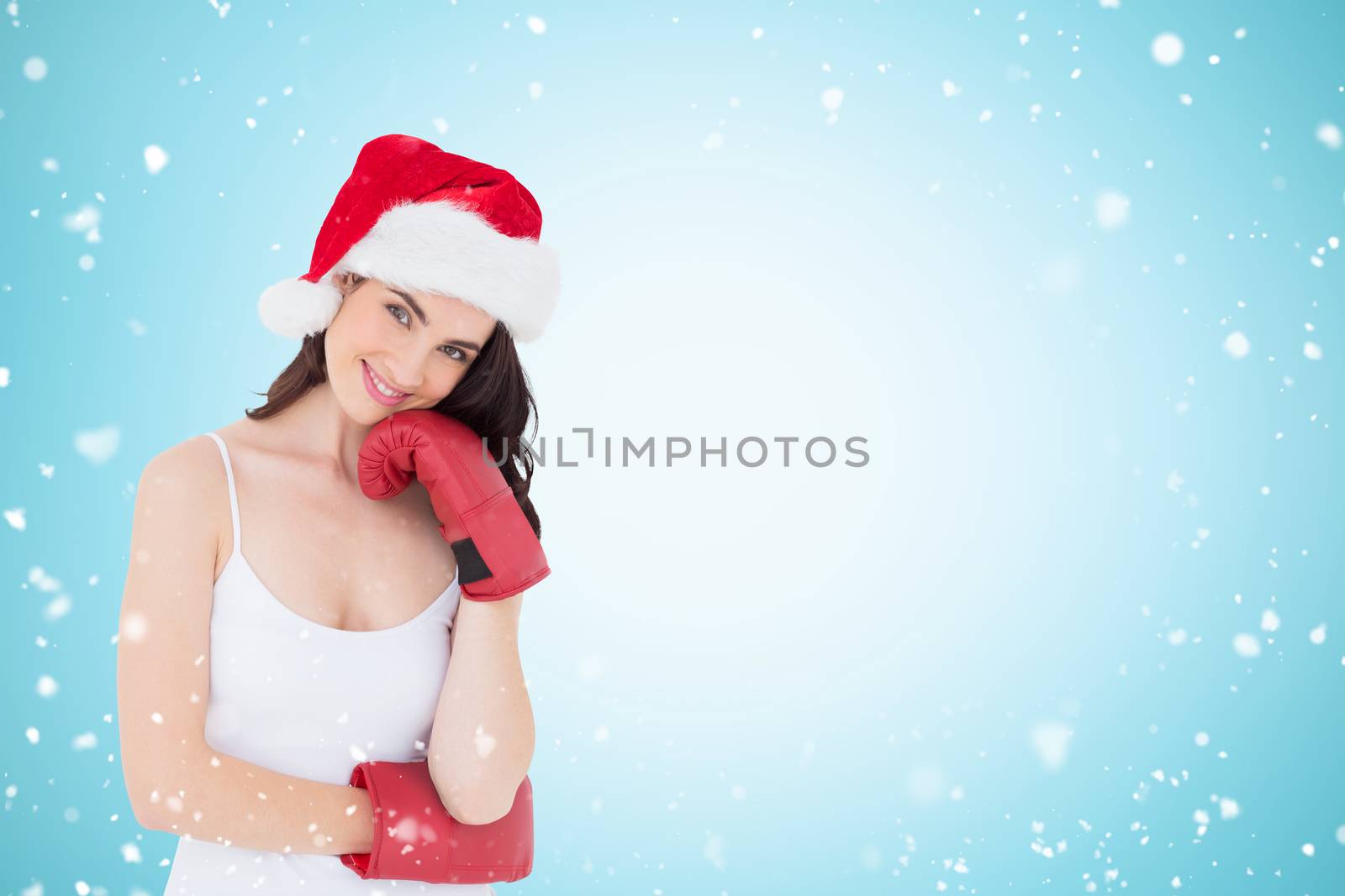 Beauty brown hair in boxing gloves against christmas snow falling
