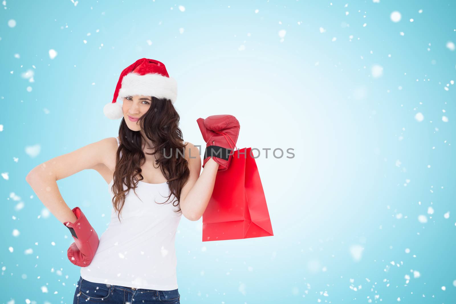 Composite image of beauty brunette in boxing gloves with shopping bag by Wavebreakmedia