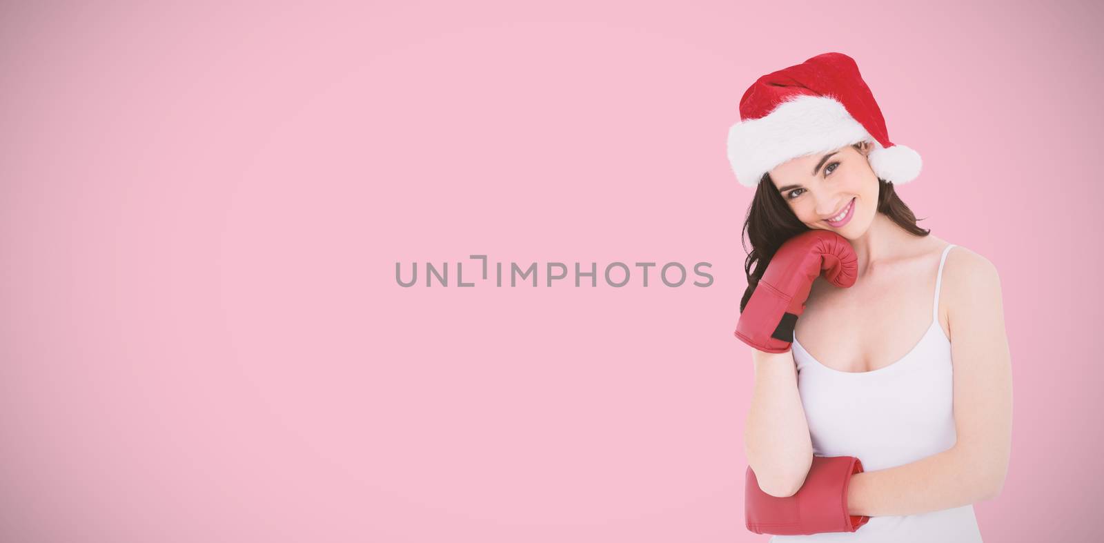 Beauty brown hair in boxing gloves against pink background