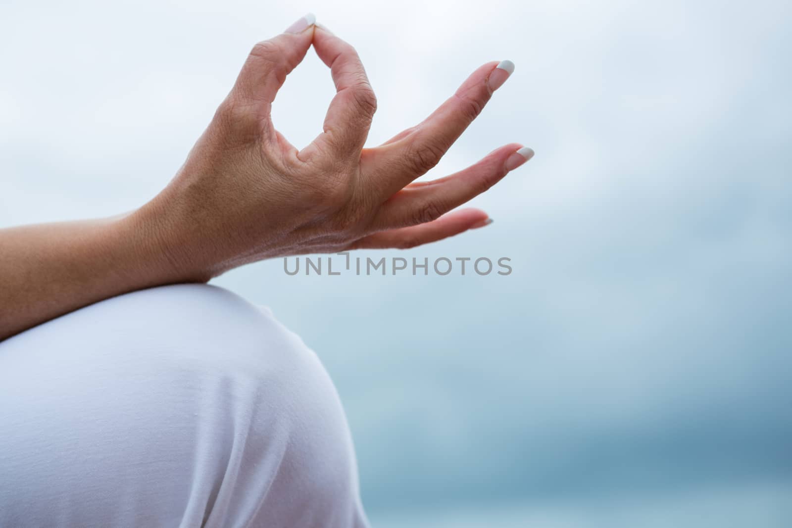 Close-up of woman performing yoga by Wavebreakmedia