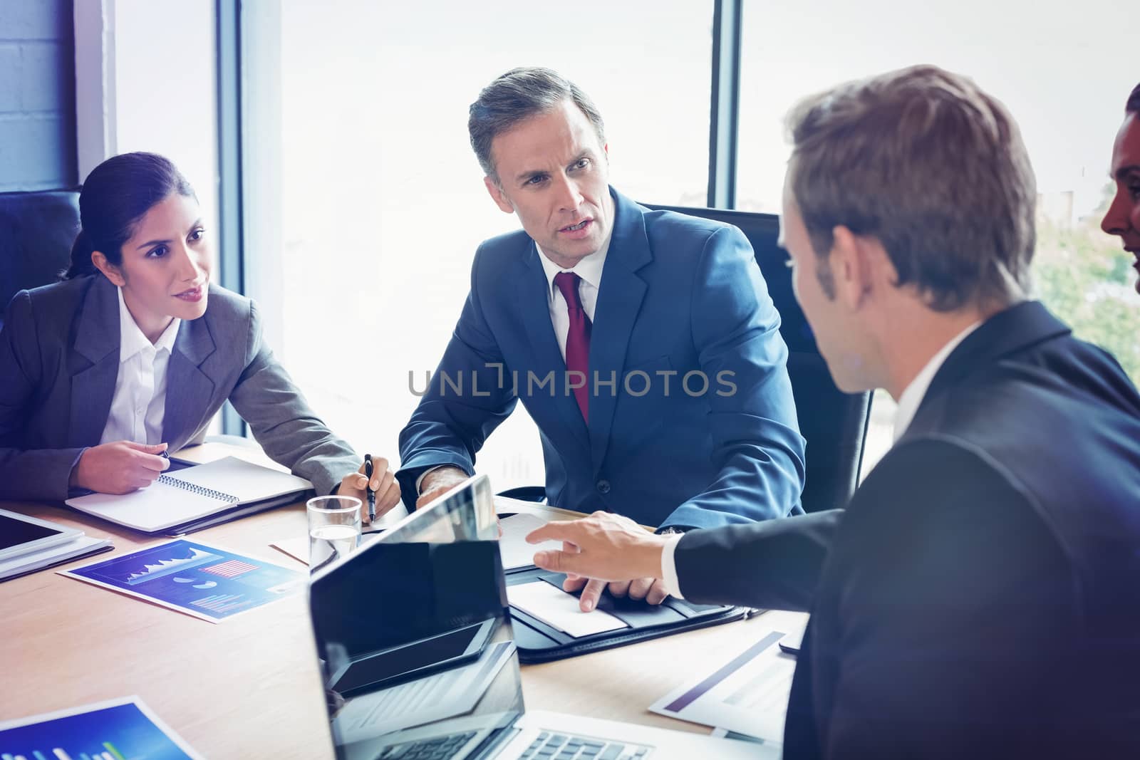 Business people interacting in conference room during meeting