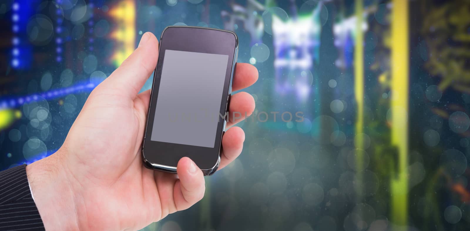 Mid section of a businessman holding smartphone against blue abstract light spot design 3d