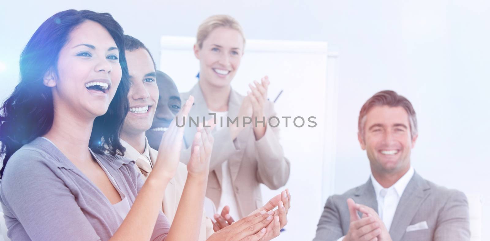 Cheerful business people applauding in a meeting. Business concept.