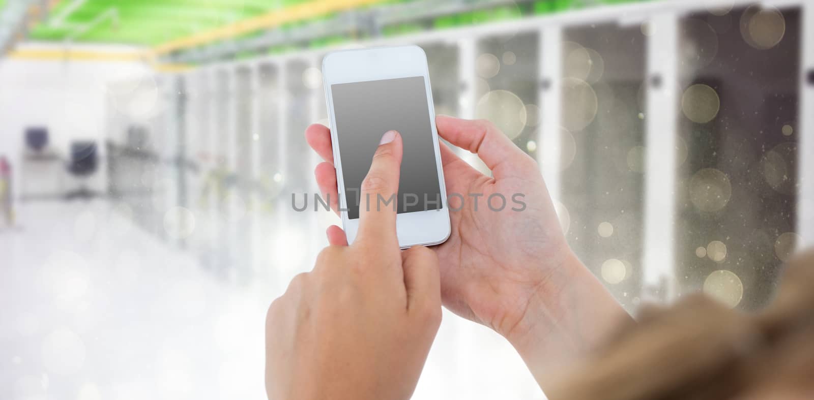 Woman using her smartphone  against black abstract light spot design 3d