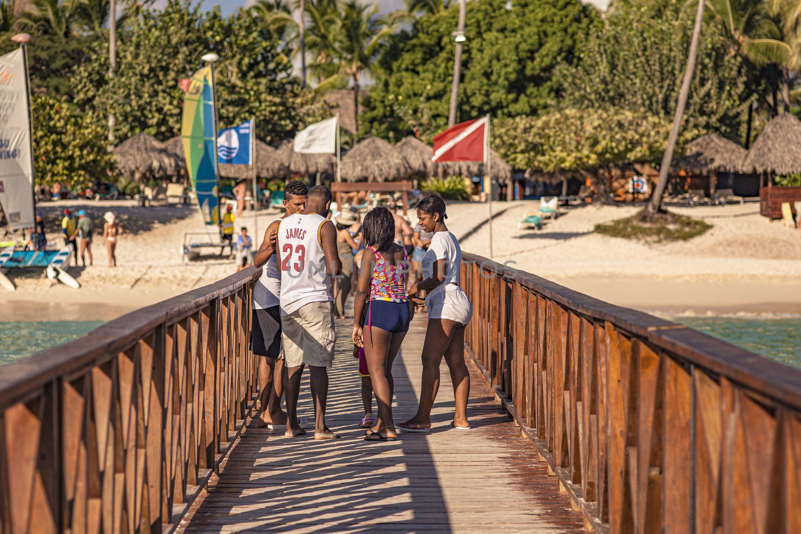 People walk on the Dominicus pier at sunset by pippocarlot