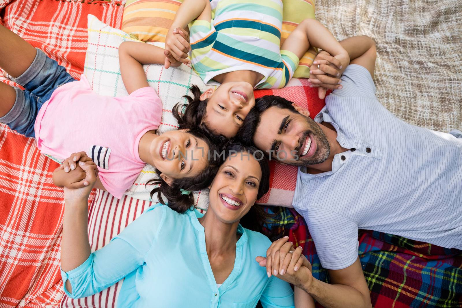 Portrait of family having fun in park by Wavebreakmedia