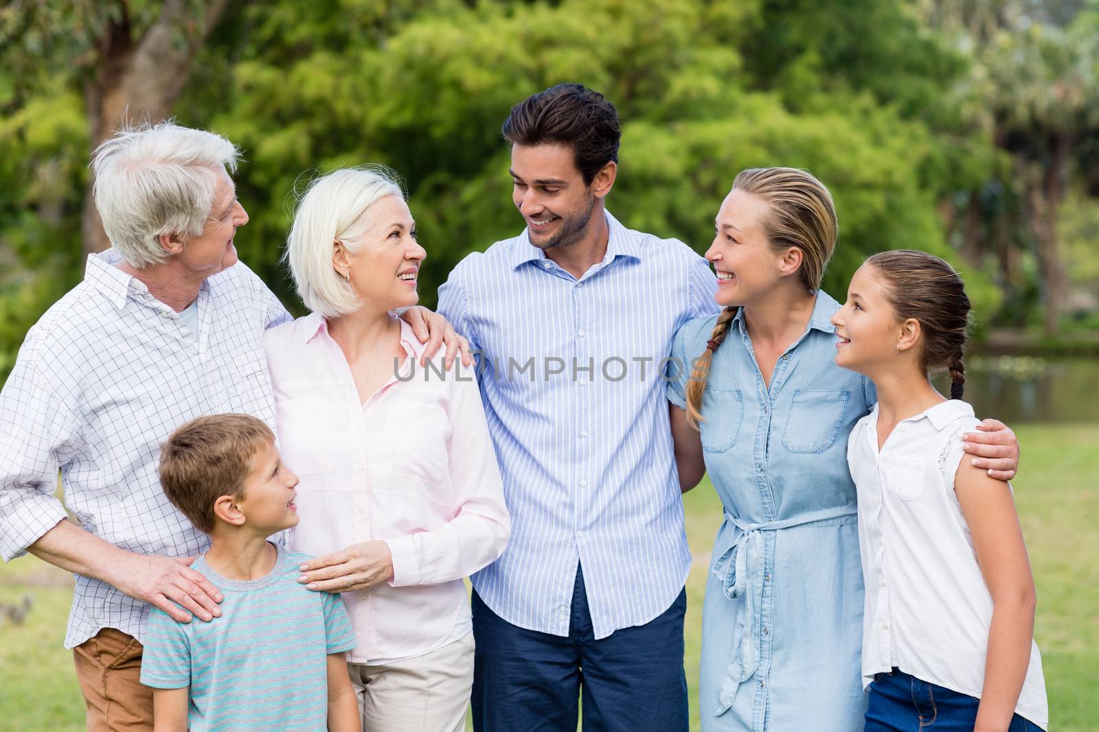 Portrait of a multi-generation family standing in park