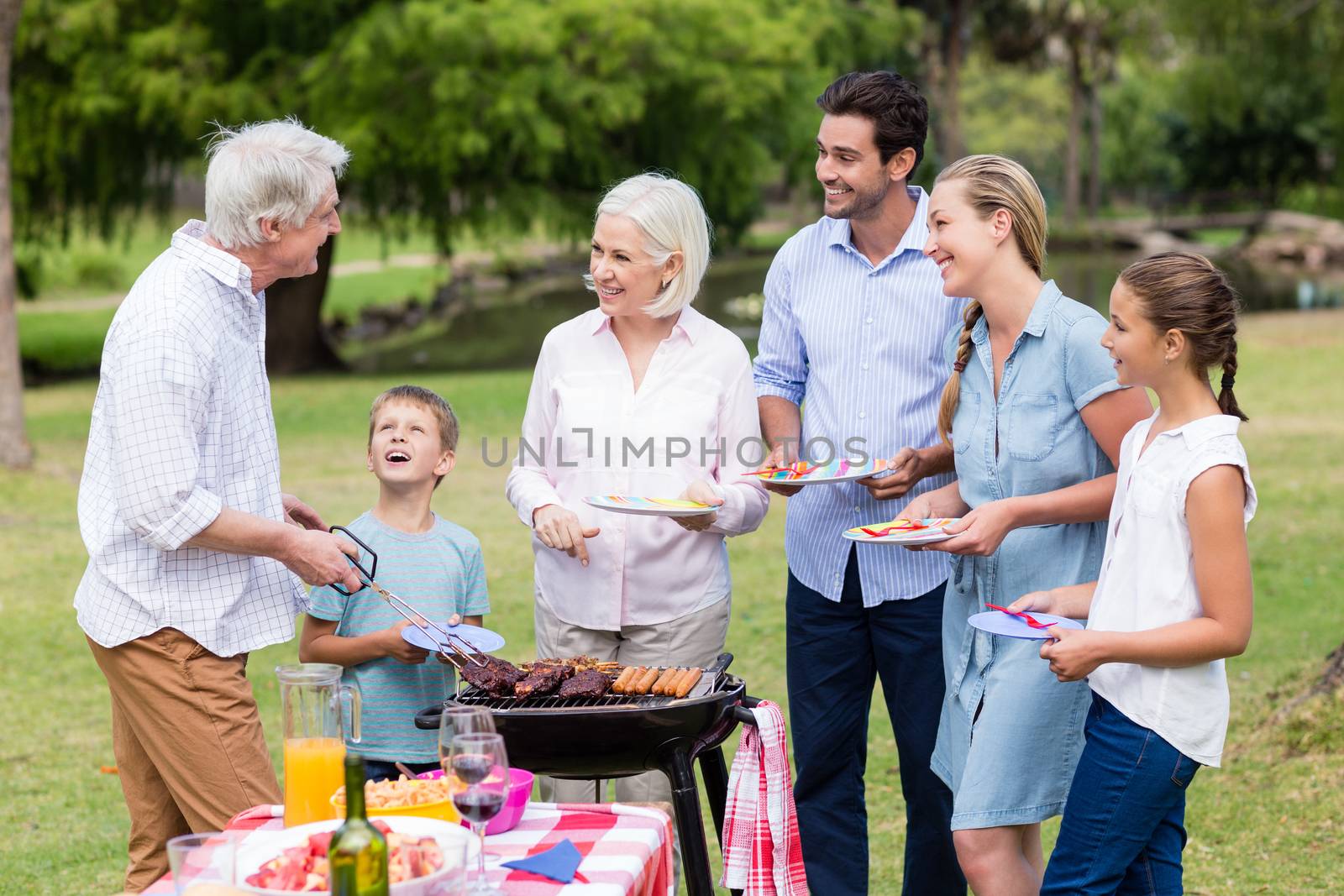 Happy family enjoying together in park