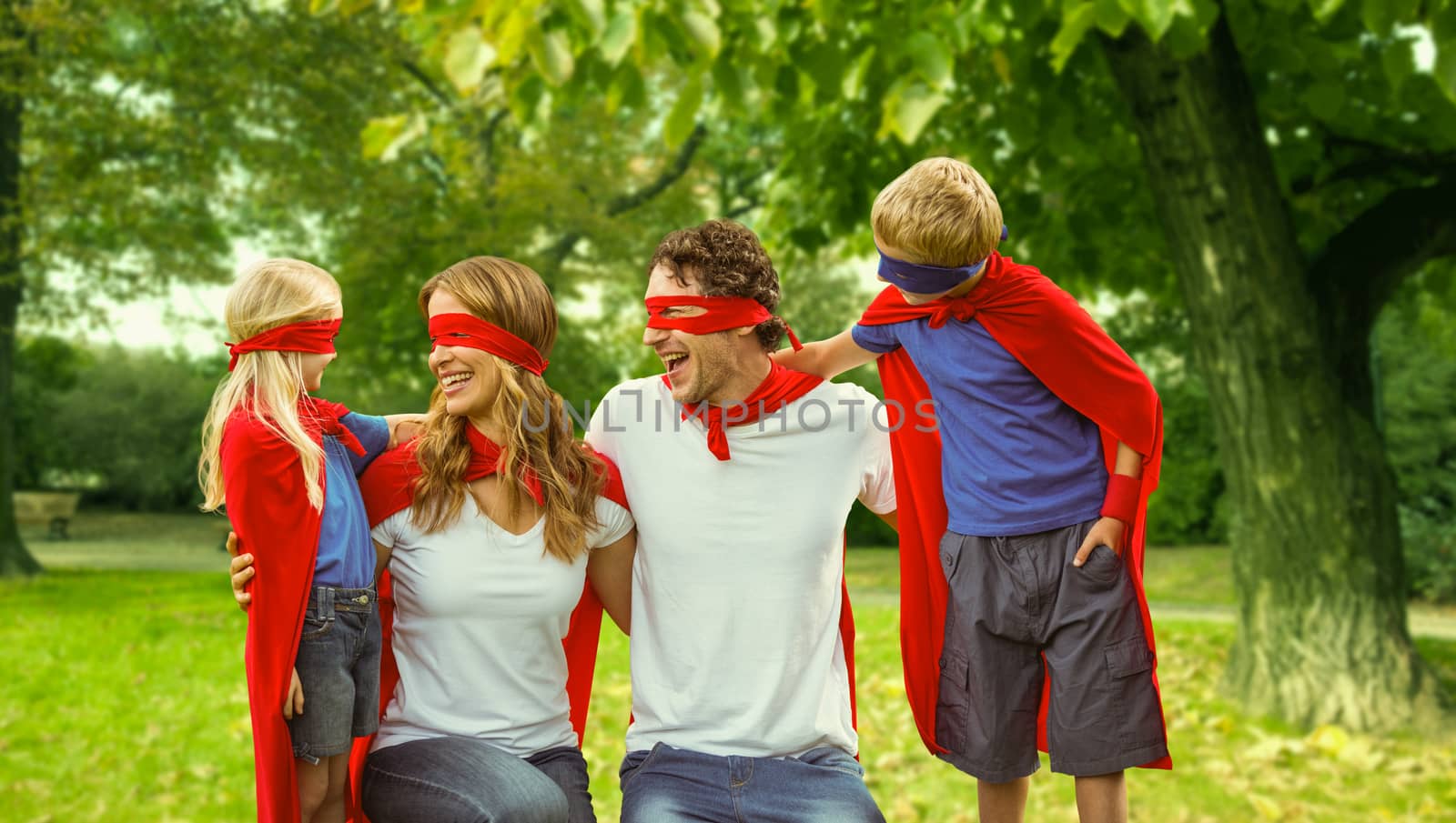 Family in superhero costume in park by Wavebreakmedia