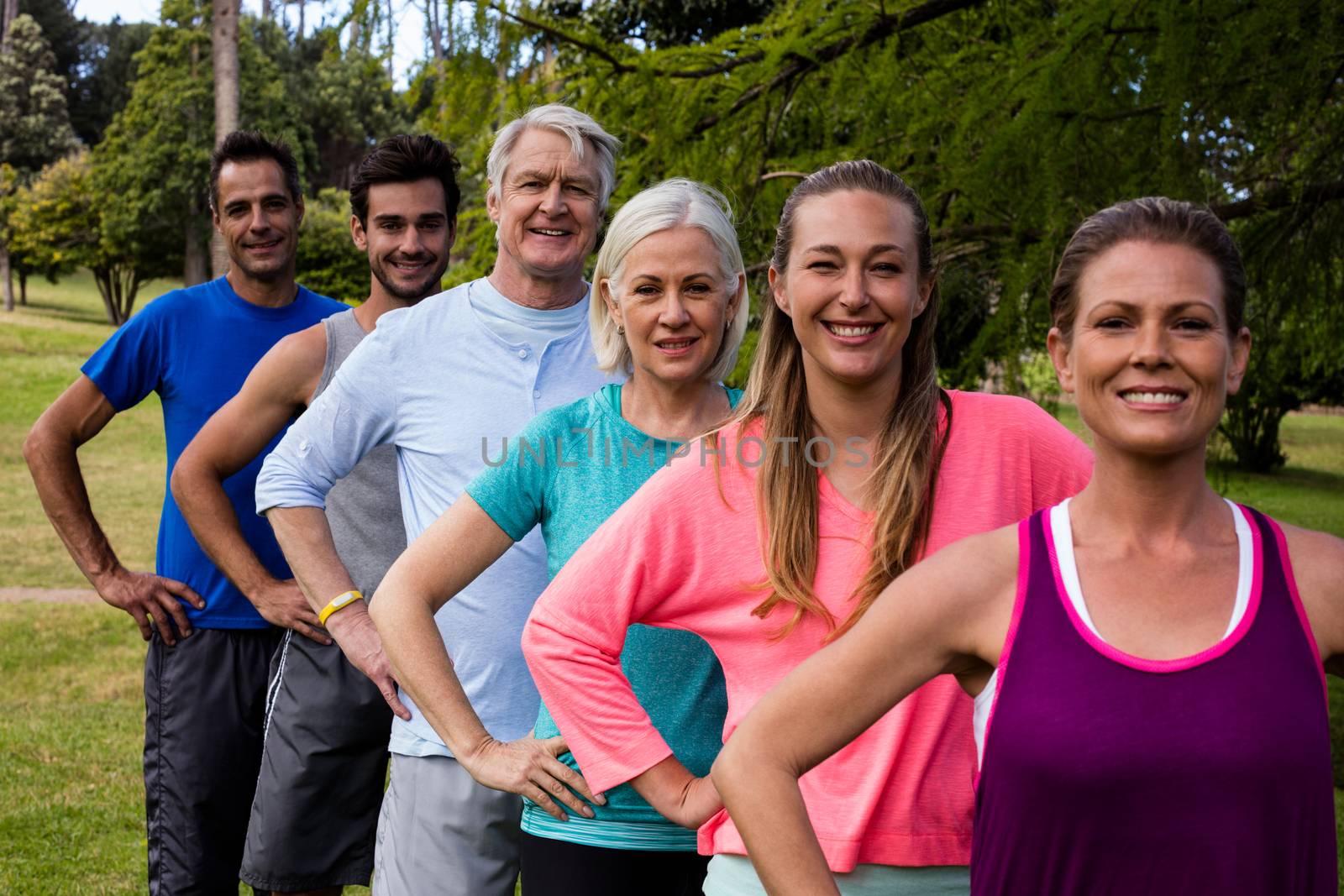 Group of people exercising together by Wavebreakmedia