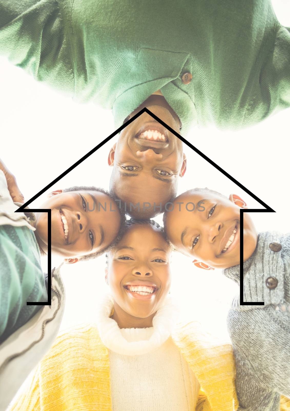 Family hugging each other against house outline in background by Wavebreakmedia