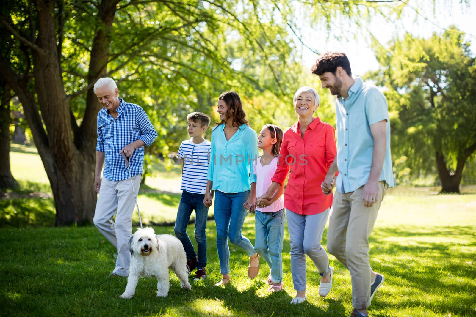 Happy family enjoying in park by Wavebreakmedia