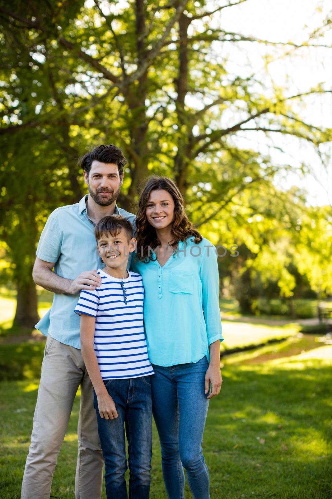 Portrait of a happy family standing in the park