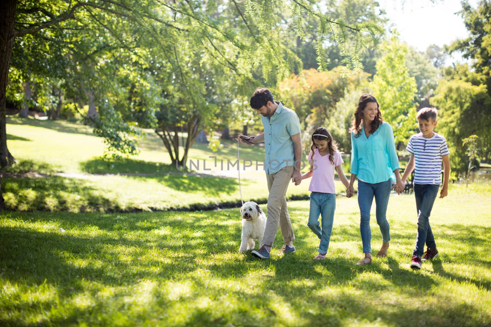 Happy family enjoying in park on sunny a day