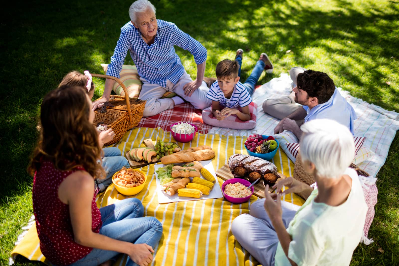 Happy family enjoying in park on sunny a day